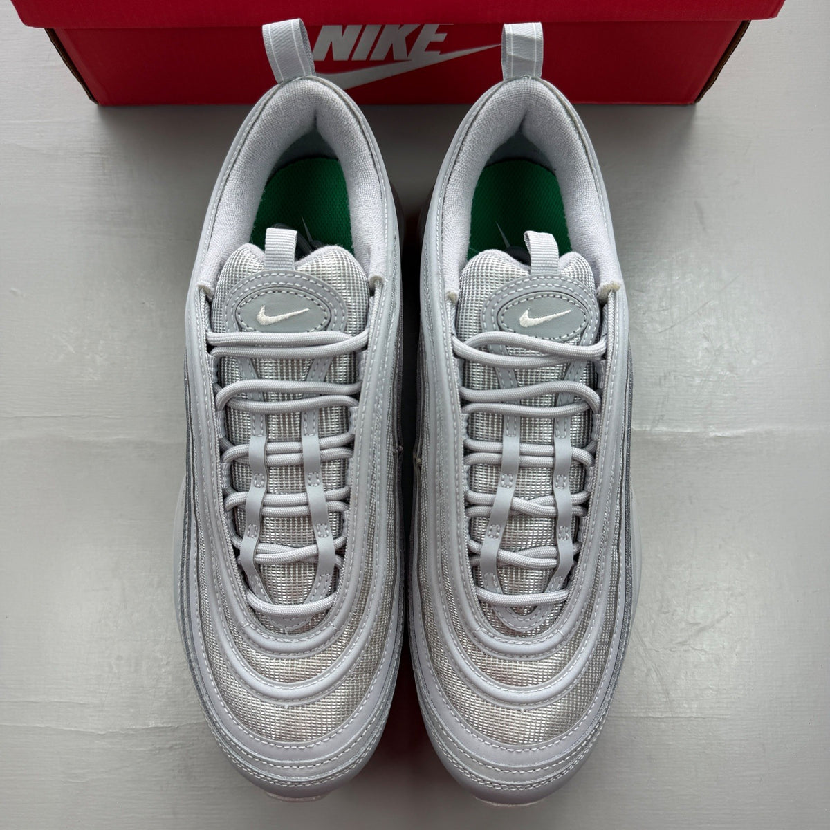 Nike grey deck shoes with silver accents and distinctive Air Max 97 design.