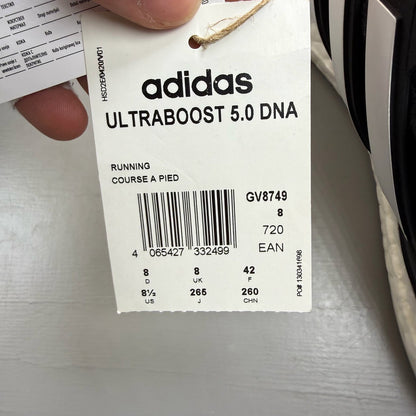 Adidas black Ultra Boost 5.0 trainers with white accents and logo detailing.