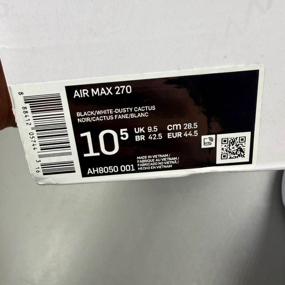 Nike deck shoes white with black accents and logo, featuring a sleek design.