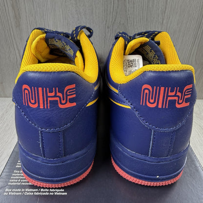 Nike blue trainers with gold accents and retro design elements.