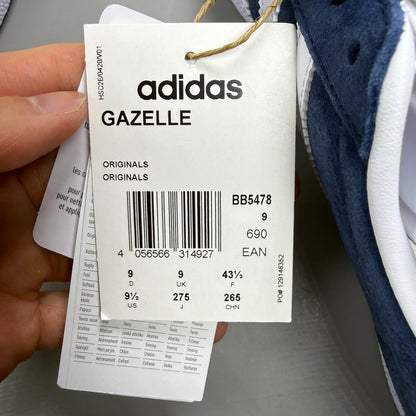 Adidas blue suede trainers with white stripes and logo detail.