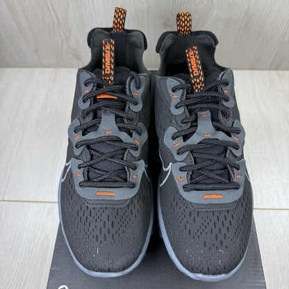 Nike React Vision black trainers with safety orange accents and unique design details.