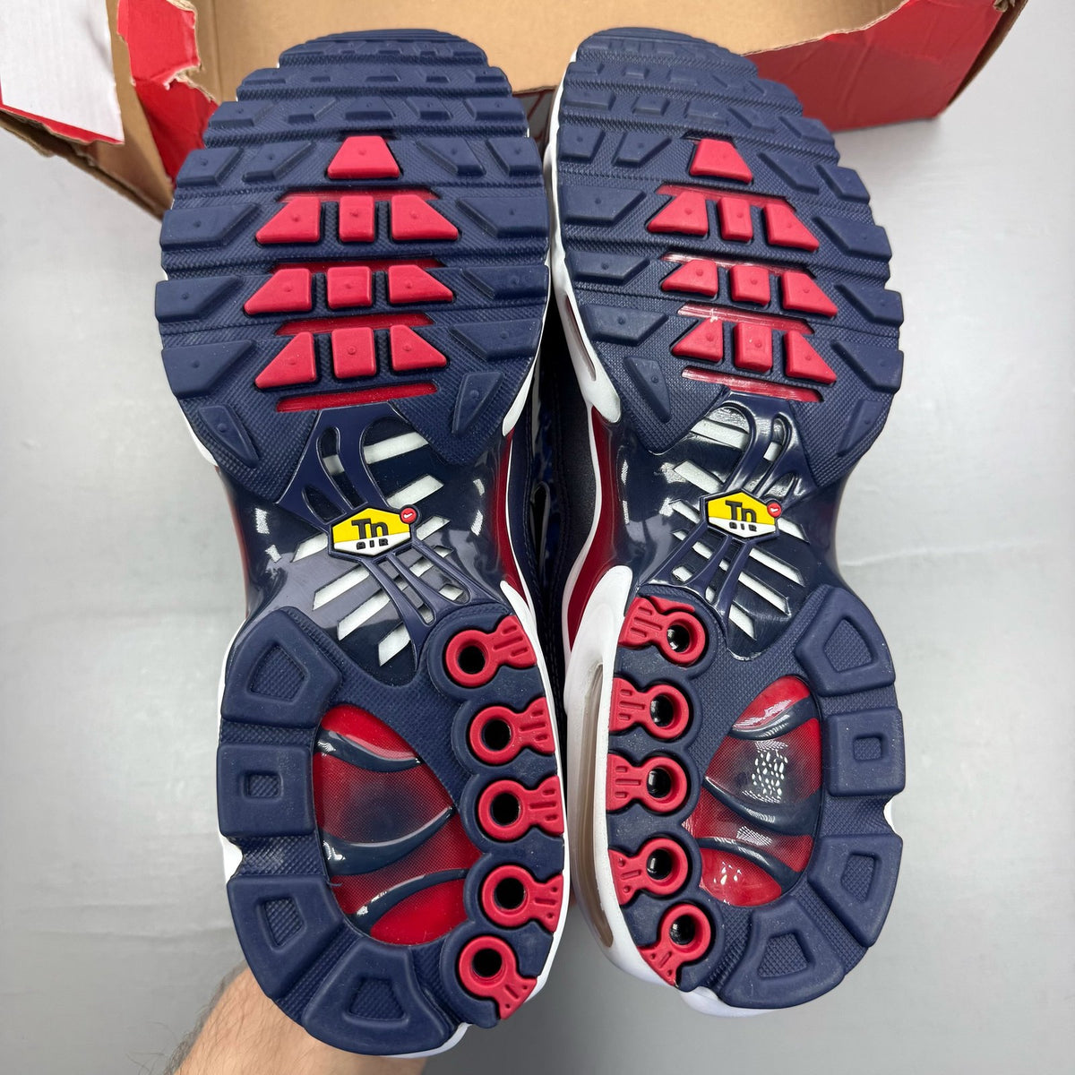 Nike Air Max Plus TN Eclair Lightning blue trainers with signature swoosh logo and mesh detailing.