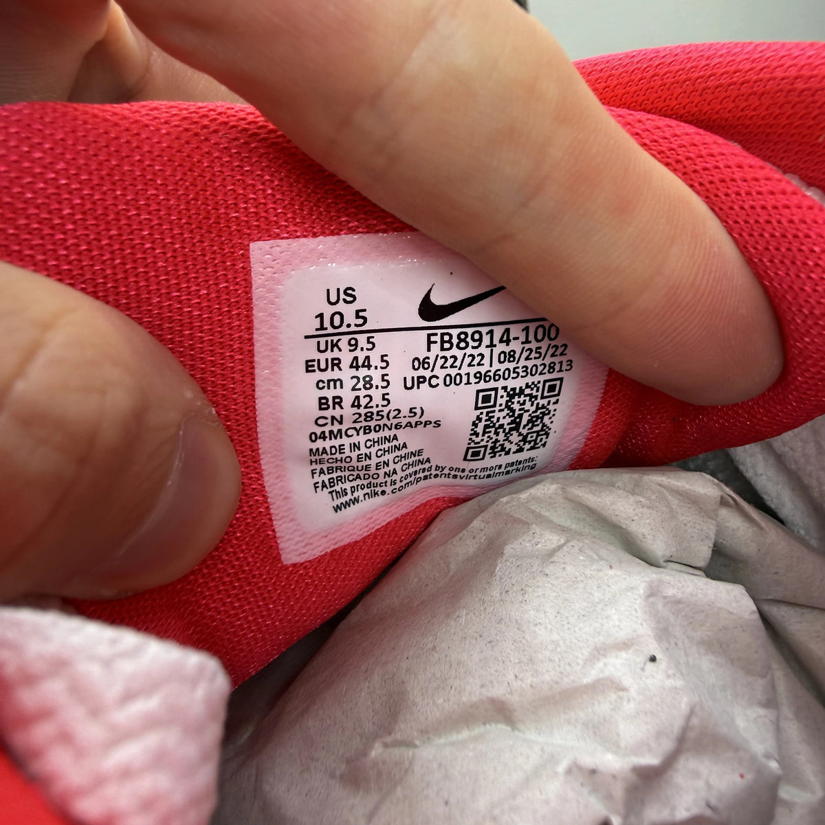 Nike Air Max 1 white trainers with LeBron James logo and Liverpool FC details.
