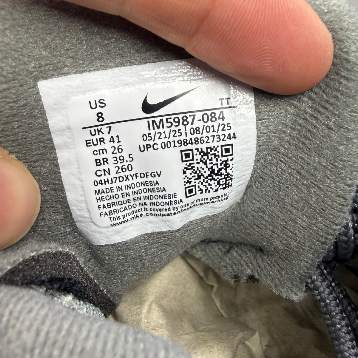 Nike running shoes grey with big bubble design and classic swoosh logo.