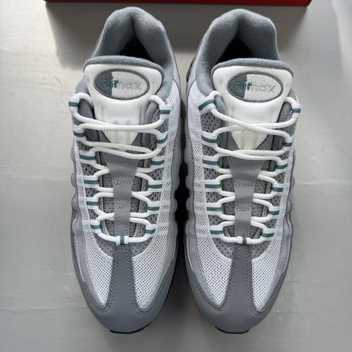 Nike Air Max 95 OG trainers grey with teal accents and big bubble sole.