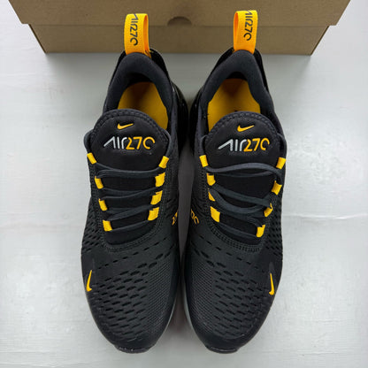 Nike black Air Max 270 trainers with grey and university gold accents, logo on tongue.