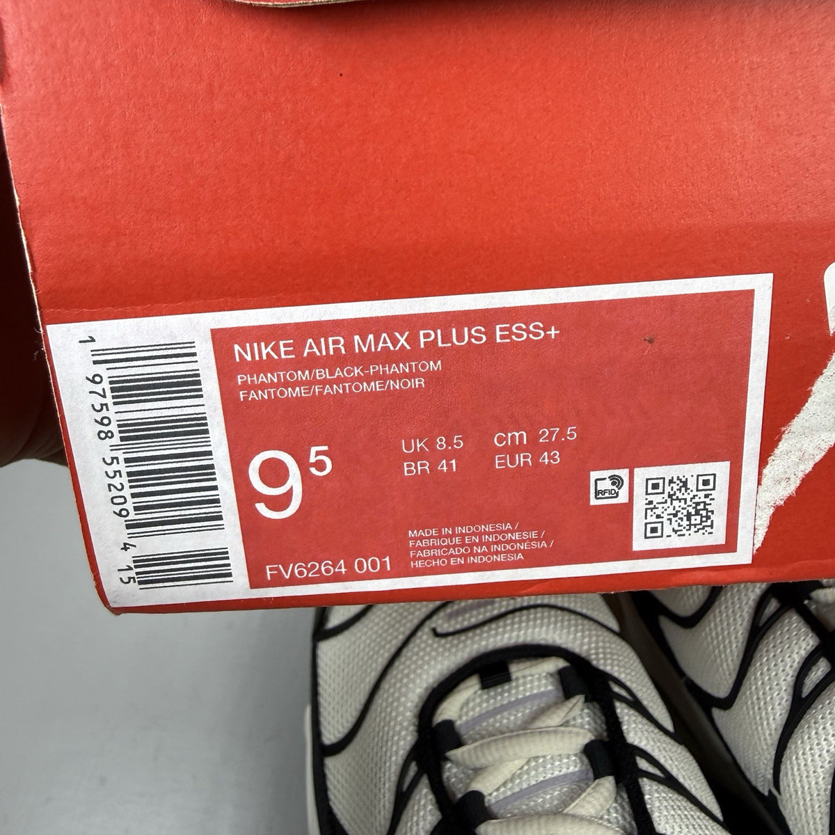 Nike Air Max Plus TN trainers white with black accents and signature logo details.