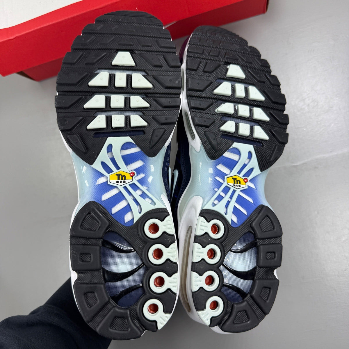 Nike blue deck shoes with logo detail and sleek design.