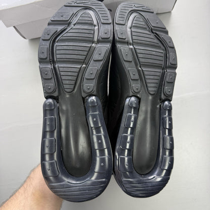 Nike Air Max 270 trainers black with logo detail and sleek design.