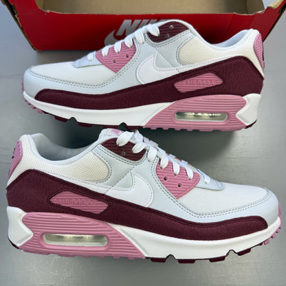 Nike Air Max 90 SE trainers multi-colour with burgundy and pink accents, logo details.
