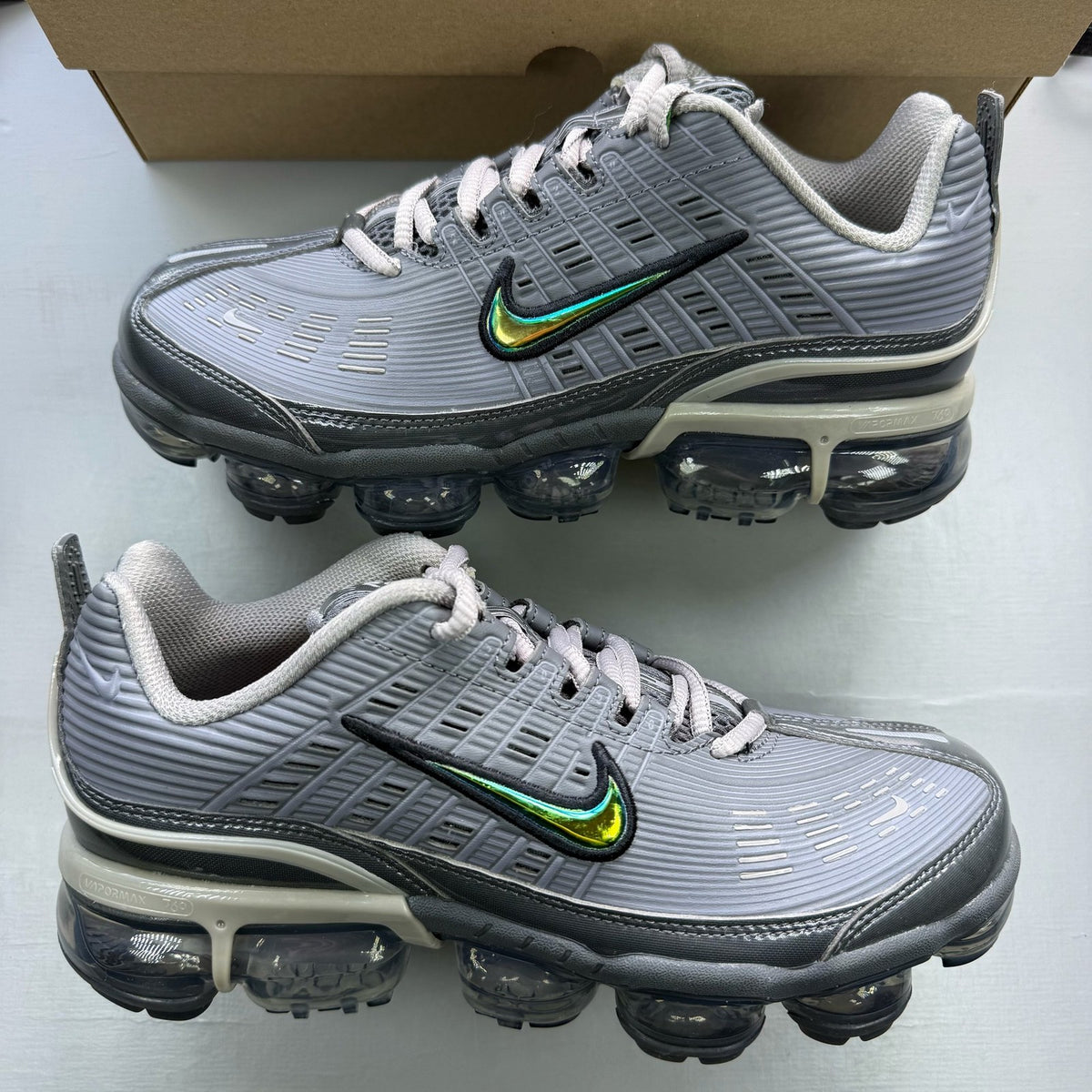 Nike Air VaporMax 360 grey trainers with unique design and textured material.
