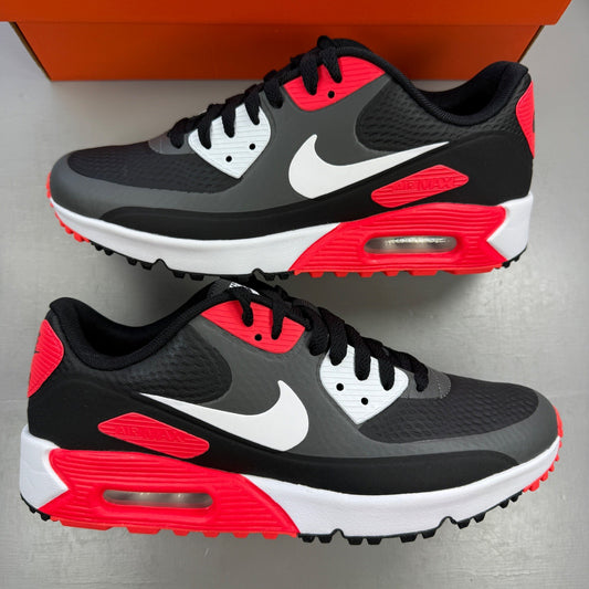 Nike trainers black with infrared accents and grey detailing, featuring Air Max cushioning.
