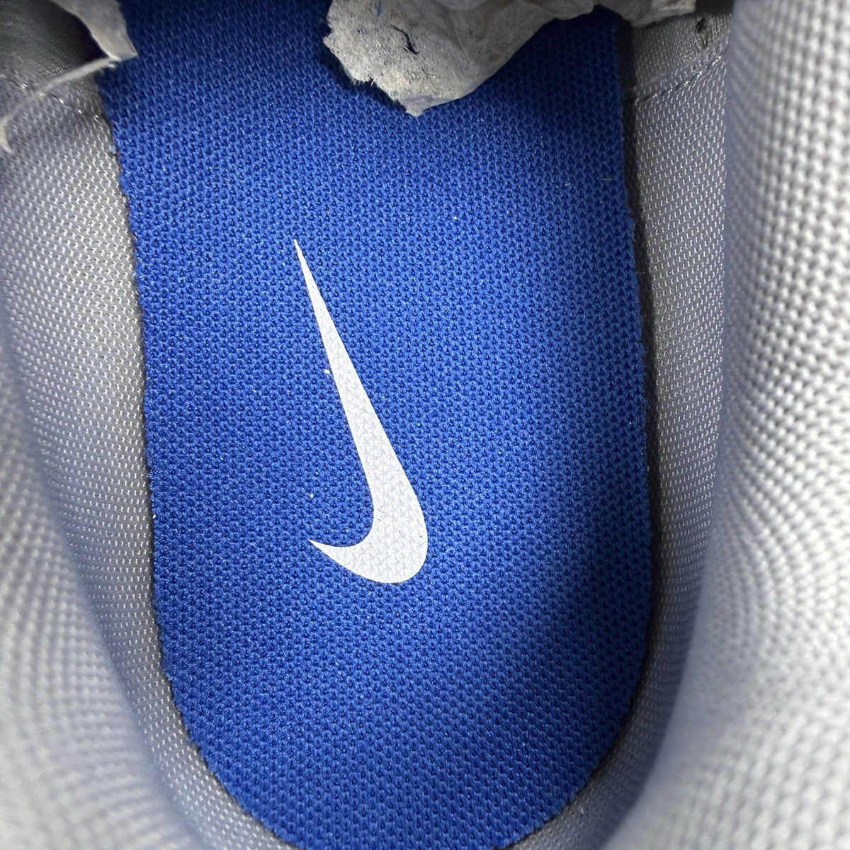 Nike P-6000 trainers white with laser blue and silver accents, mesh material, logo detail.
