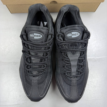 Nike Air Max 95 black trainers with cool grey accents and signature logo details.