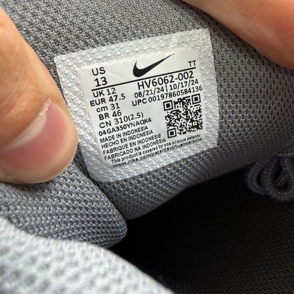 Nike Air Max 95 grey trainers with sundial accents and mesh material.