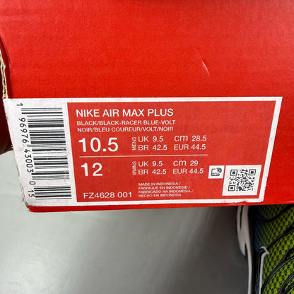 Nike Air Max Plus TN green trainers with black and volt accents, featuring signature logo.