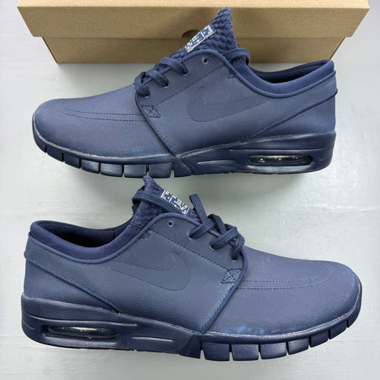 Nike deck shoes blue with logo detailing and cushioned sole design.