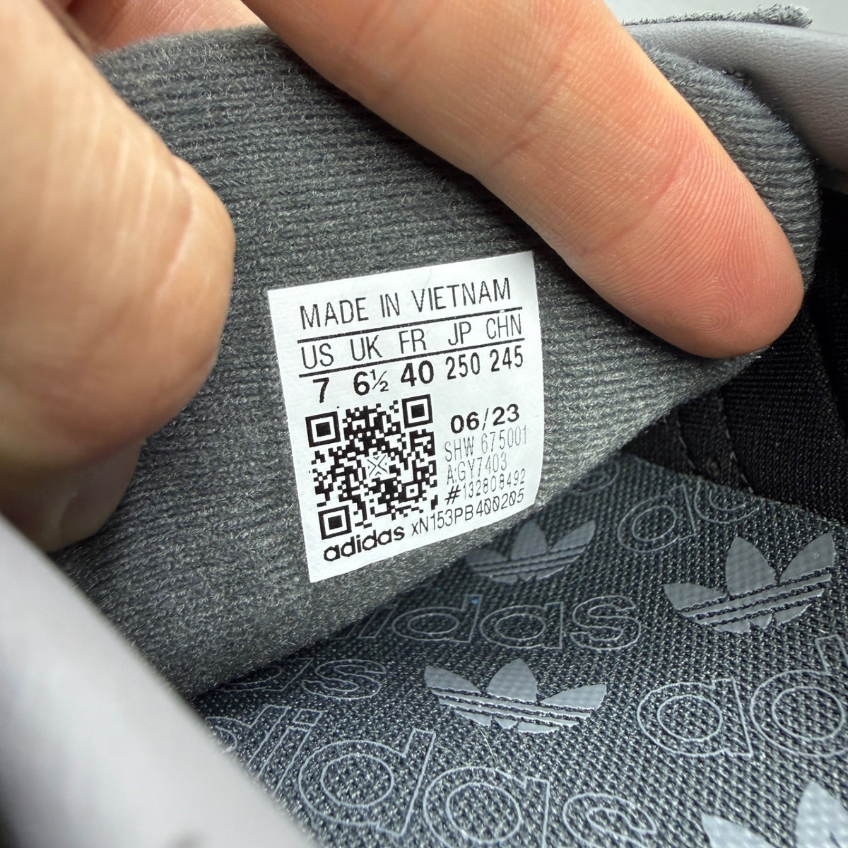 Adidas athletic shoes grey Cordura material with gum sole and logo detail.