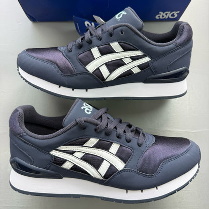 ASICS blue trainers with white accents and logo detail on the side.