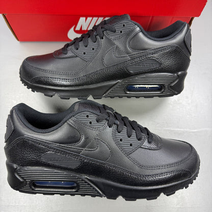 Nike athletic shoes black leather with Air Max branding and textured design.