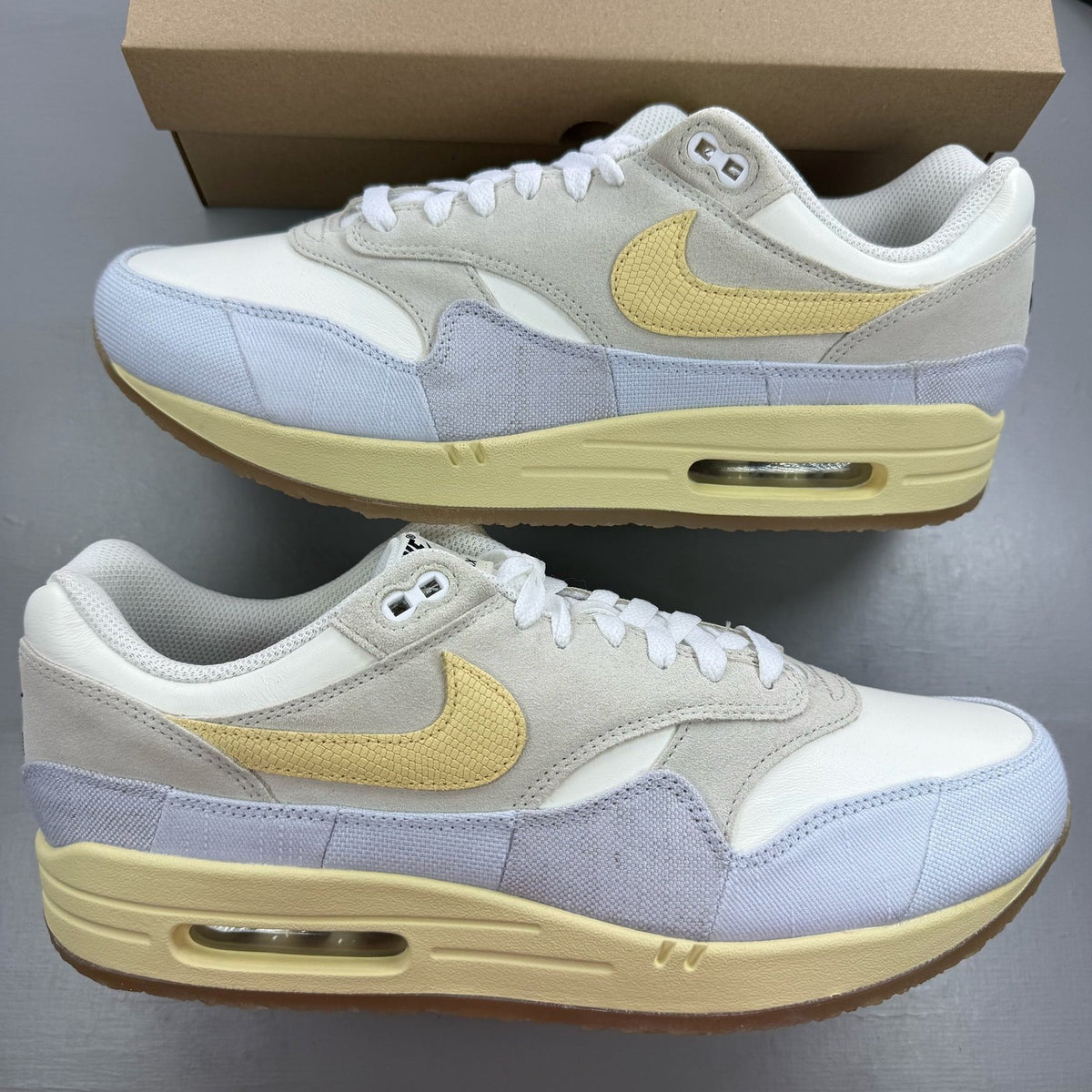 Nike Air Max 1 87 trainers beige with crepe sole and subtle logo detail.
