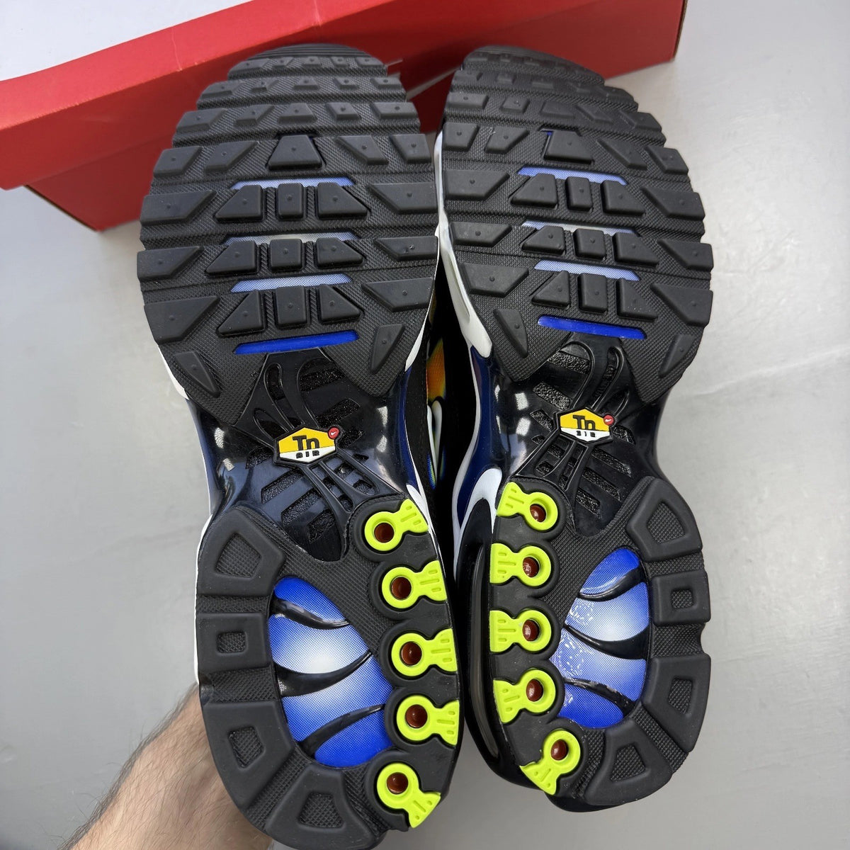 Nike trainers black with yellow heat map pattern and signature swoosh logo.