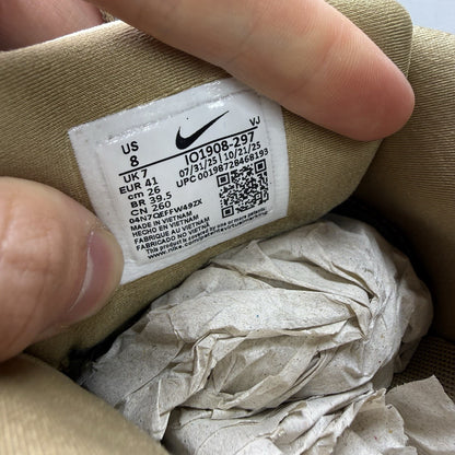 Nike Air Max 90 Drift beige trainers with black and brown accents, featuring logo detail.