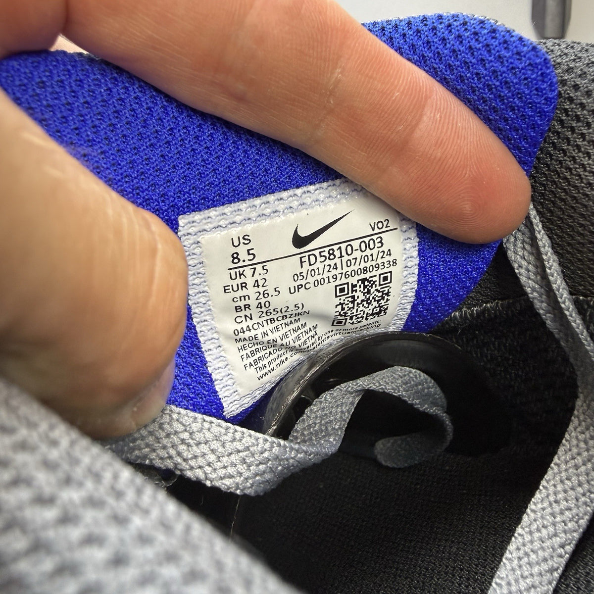 Nike Air Max 90 trainers cool grey with blue accents and Gore-Tex material.
