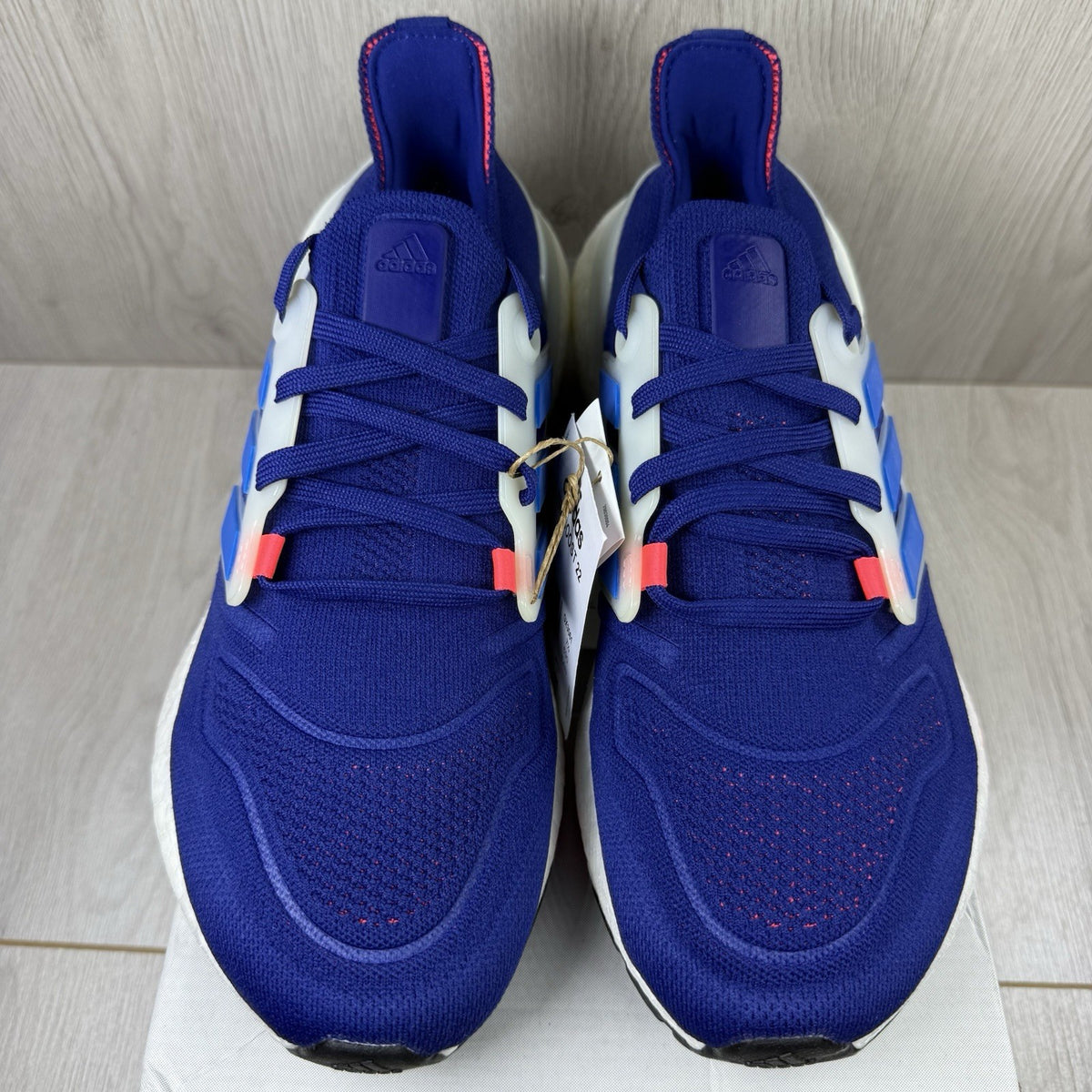 Adidas Ultra Boost 22 trainers in legacy indigo with turbo blue and white accents.