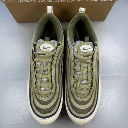 Nike trainers green with light bone accents and Air Max cushioning design.