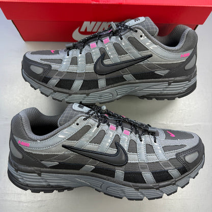 Nike P-6000 grey trainers with pink and black accents, mesh upper and logo detail.