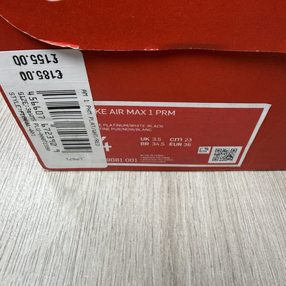 Nike Air Max 1 trainers grey with white accents and signature swoosh logo.