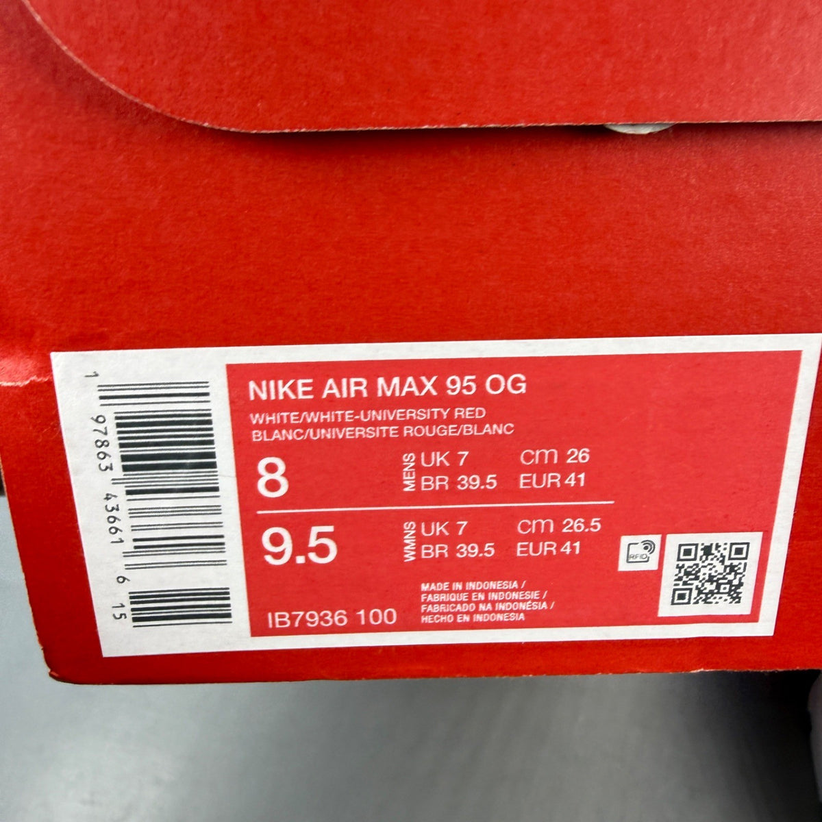 Nike trainers white with red accents and big bubble sole design.