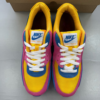 Nike Air Max 90 multicolor suede trainers with yellow and blue accents.