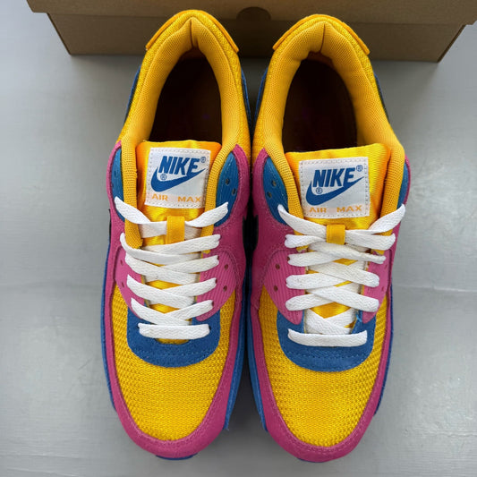 Nike Air Max 90 multicolor suede trainers with yellow and blue accents.