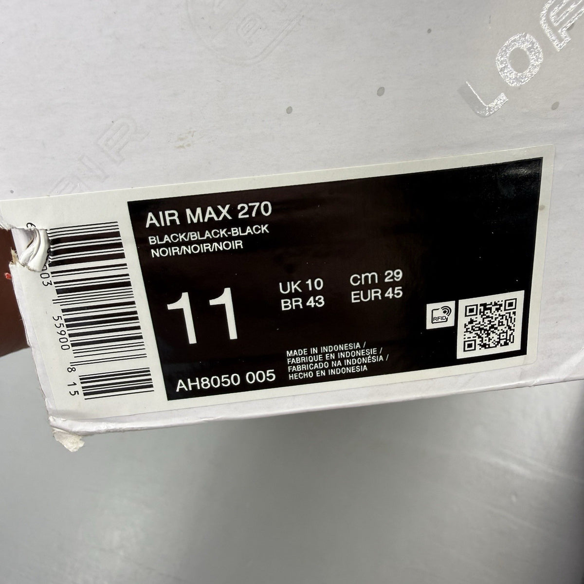 Nike Air Max 270 trainers black with logo detail and sleek design.