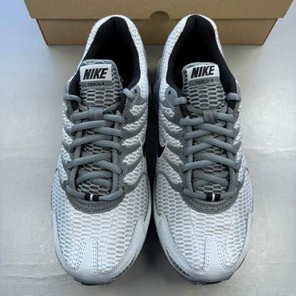Nike Air Max Torch 4 grey and white trainers with mesh upper and signature swoosh logo.