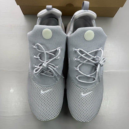 Nike Presto Fly grey trainers with white accents and logo detail.