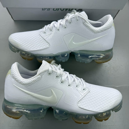 Nike white trainers with gum sole and silver accents, featuring breathable mesh upper.