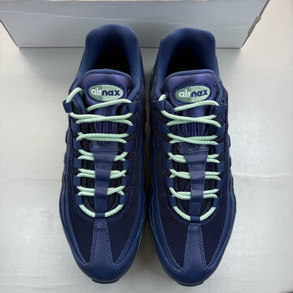 Nike Air Max 95 navy blue trainers with green accents and classic logo detailing.