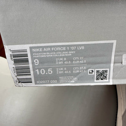 Nike Air Force 1 grey trainers with black accents and signature swoosh logo.