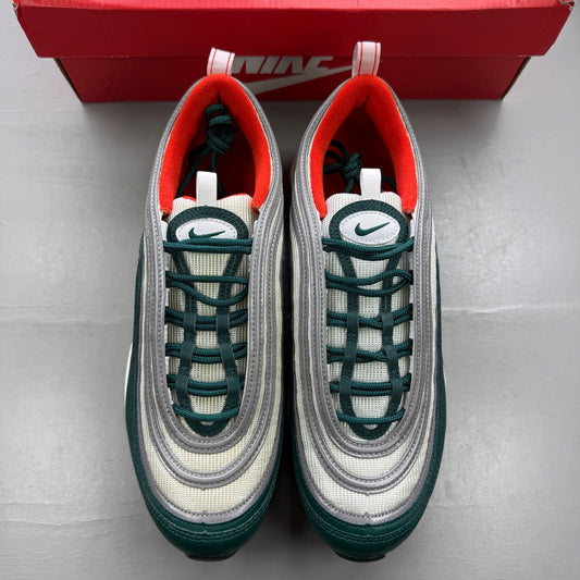 Nike trainers orange with rainforest accents and Air Max cushioning details.