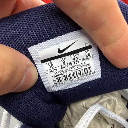 Nike Air Max 95 white trainers with midnight navy and laser orange accents.