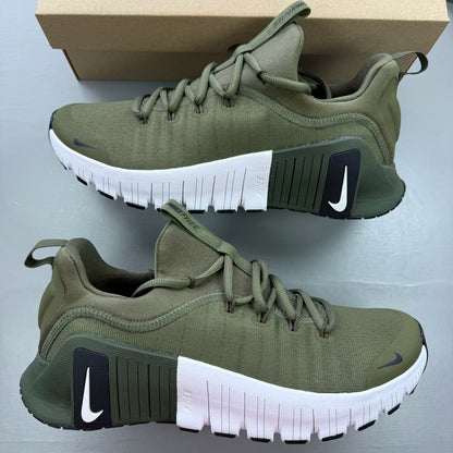 Nike green trainers with breathable mesh upper and cushioned sole.
