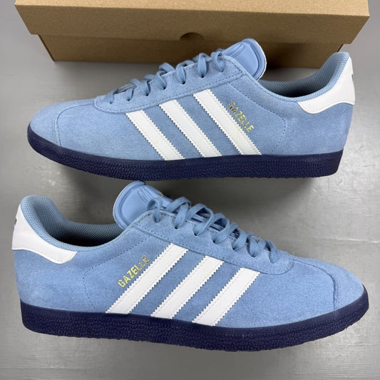 Adidas athletic shoes sky blue with white stripes and logo detail.