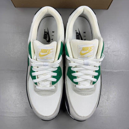 Nike trainers white with malachite and black accents, featuring iconic Air Max design.