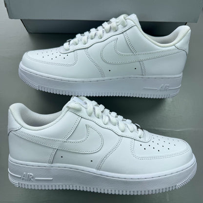 Nike Air Force 1 '07 white trainers with classic silhouette and embossed logo.