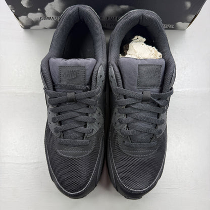 Nike trainers black with Air Max cushioning and signature swoosh logo.