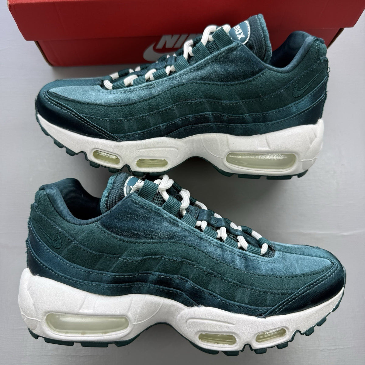 Nike Air Max 95 green velvet trainers with teal accents and white sole.